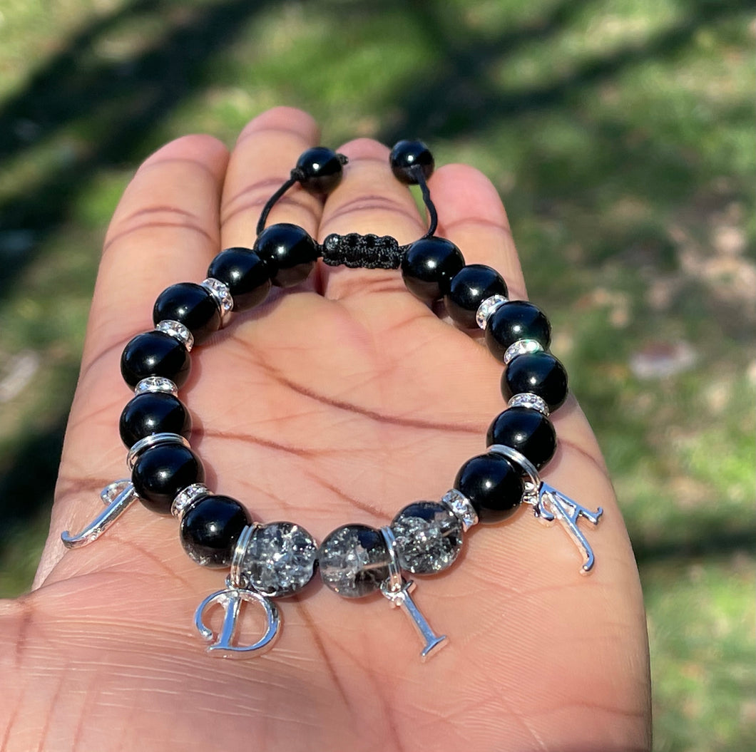 Customized onyx/clear crackle shambala bracelet.